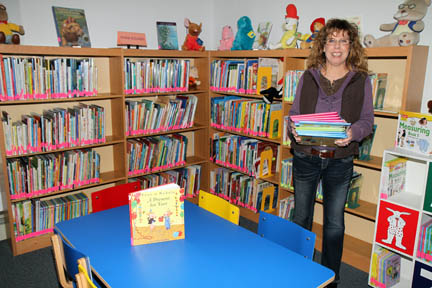 Mancelona Library Director Linda Johnson in the children's book section at the township library